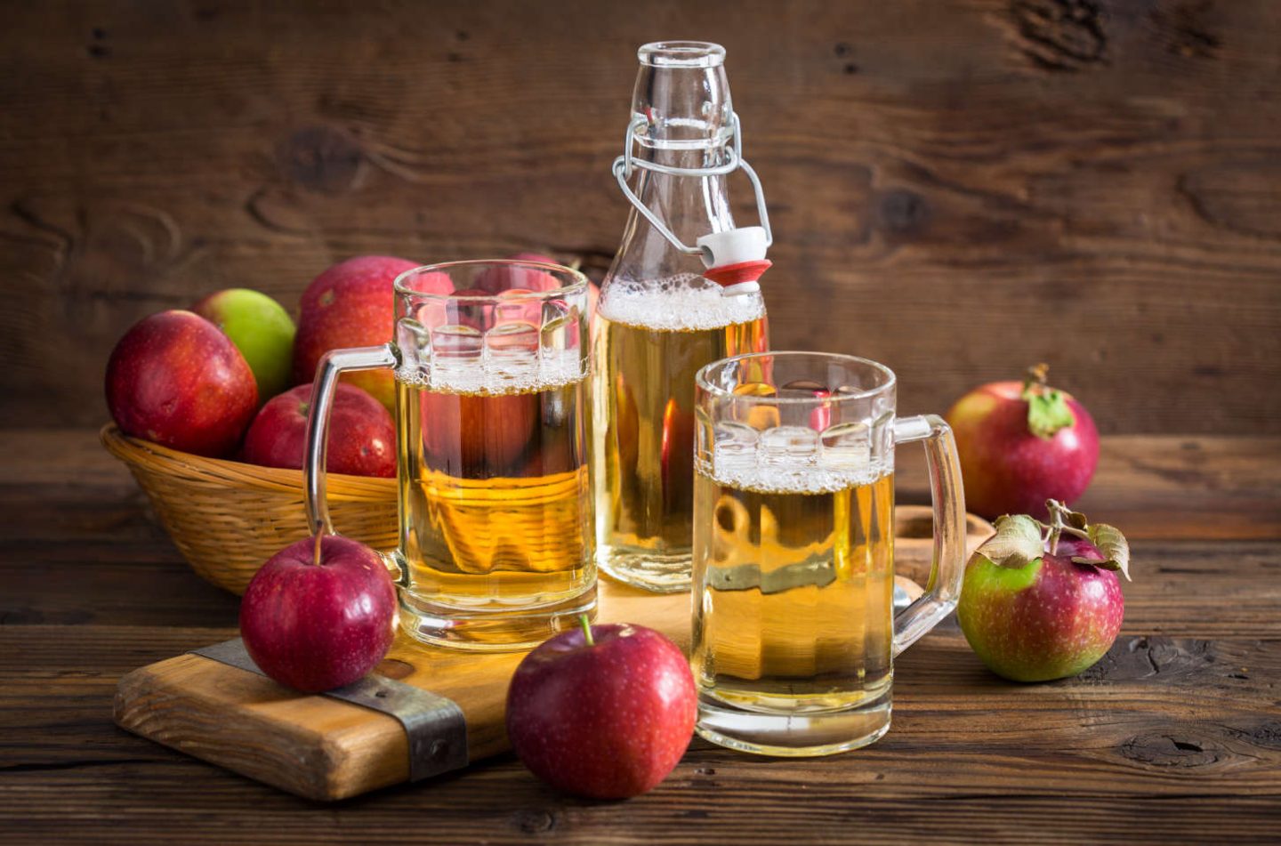 red cider apple hanging on a branch