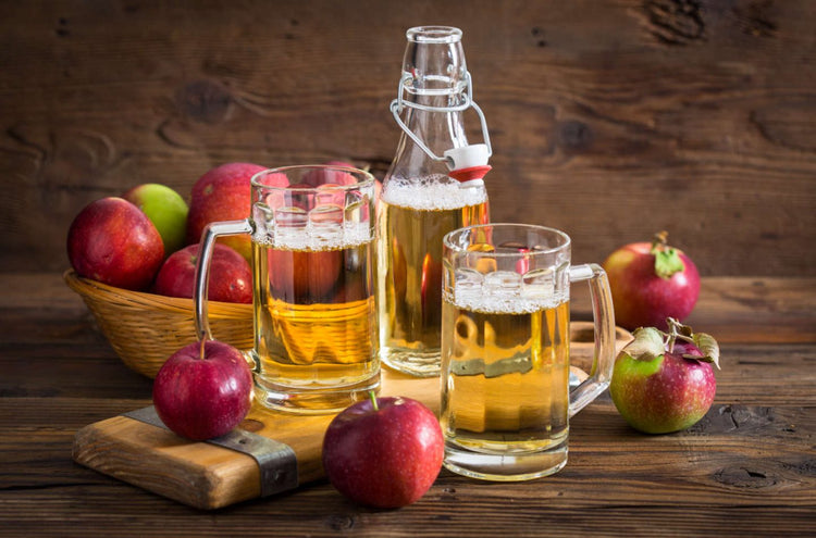 red cider apple hanging on a branch